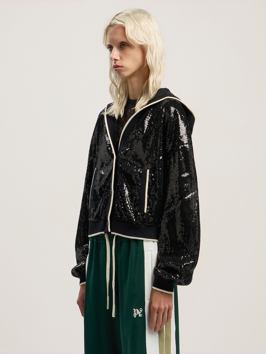 kurze jacke mit geschwungenem logo und pailletten