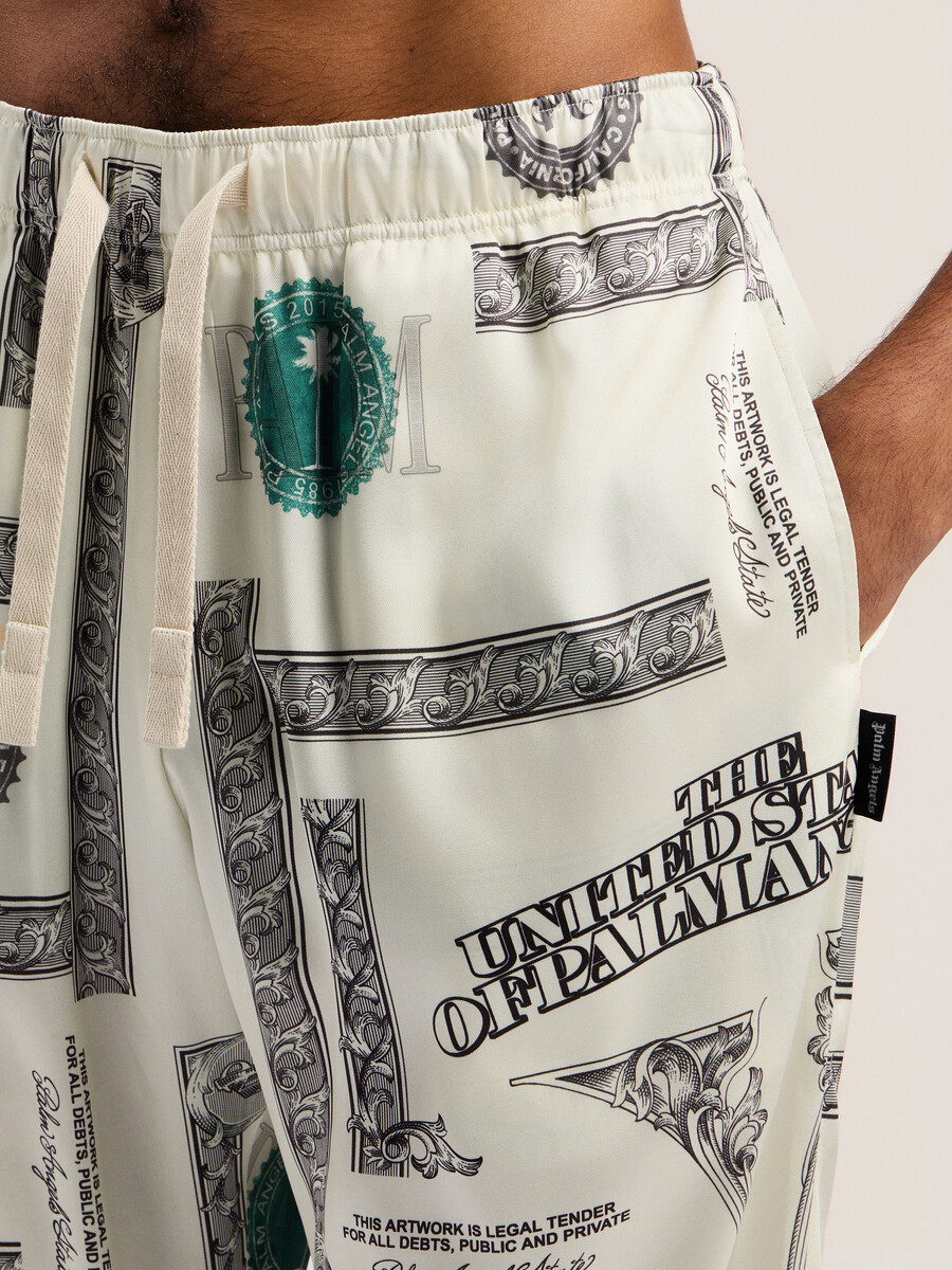 weite hose mit dollar-print